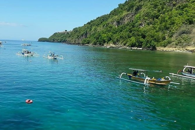Bali ATV Quad Bike and Snorkeling at Blue Lagoon Tanjung Jepun Combination Tour - Padang Bai fishing village: getting to the snorkel grounds by boat