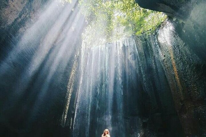 Bali best waterfall - Tukad Cepung: the cliff-framed waterfall and its light effect