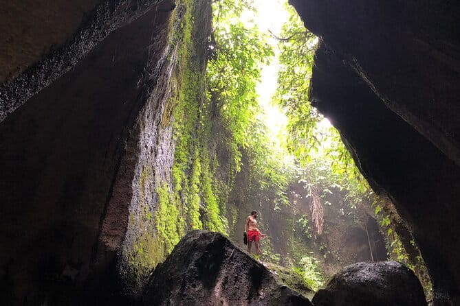 BALI INSTAGRAM TOURS; Heaven Gate, Tirta Gangga, Tukad Cepung waterfall - Stop 2: Tirta Gangga Water Gardens with koi, pavilions, and calm