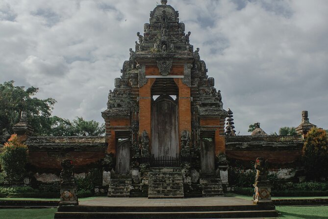 Full Day Private Tour to Ubud Waterfall and Tanah Lot Sunset - Tegenungan Waterfall: stepping down for views and that cool break