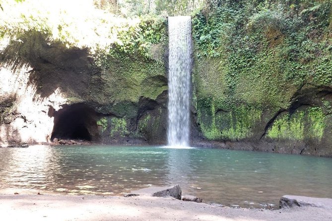 Get wet on Bali's most stunning waterfalls - Tibumana Waterfall: swim time in rainforest shade