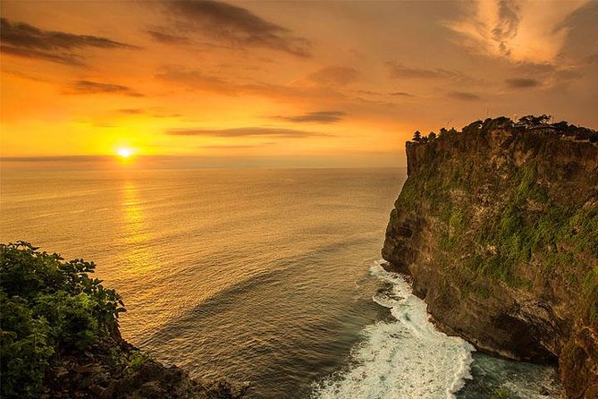 Private Uluwatu Temple Full-day Tour & Visit Padang-Padang Beach and Single Fin - Padang-Padang Beach cliffs and the Single Fin moment: stairs and that cliffside drama