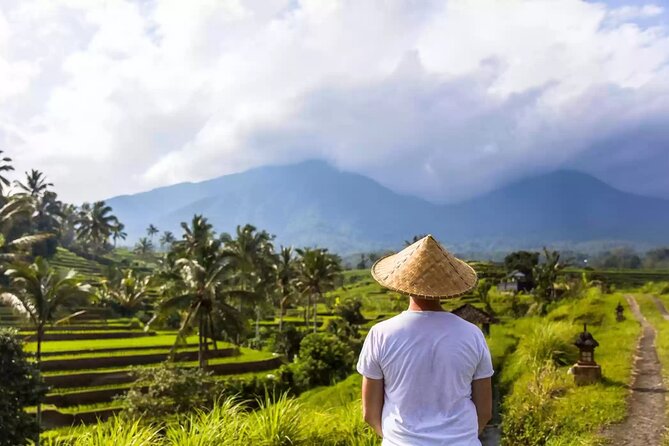 Tanah Lot, Jatiluwih Rice Terrace and Waterfall Day Tour - Stop 1: Tanah Lot Temple, the Sea Temple on the Rock