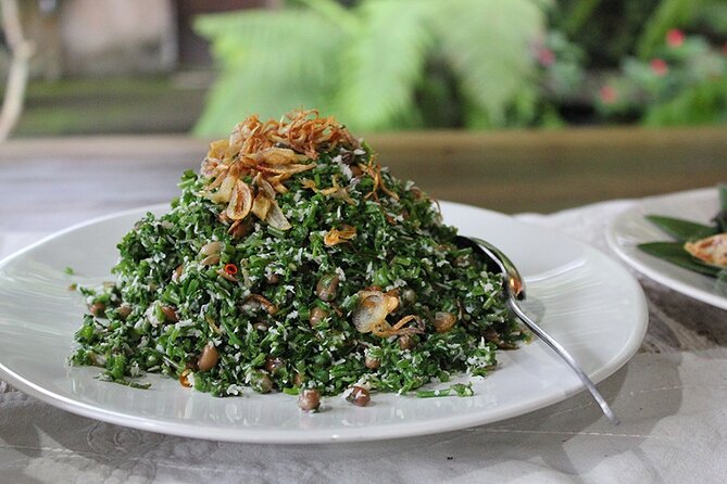 Traditional Balinese Meal in Ubud in Dewa's Family Village Home - Entering the compound: where herbs, fruits, and family life meet
